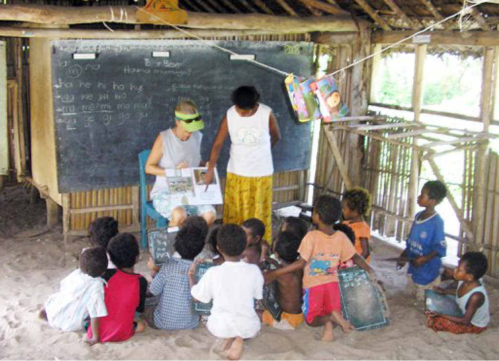 A group of youngsters has a lesson in the old classroom. A group of youngsters has a lesson in the old classroom.